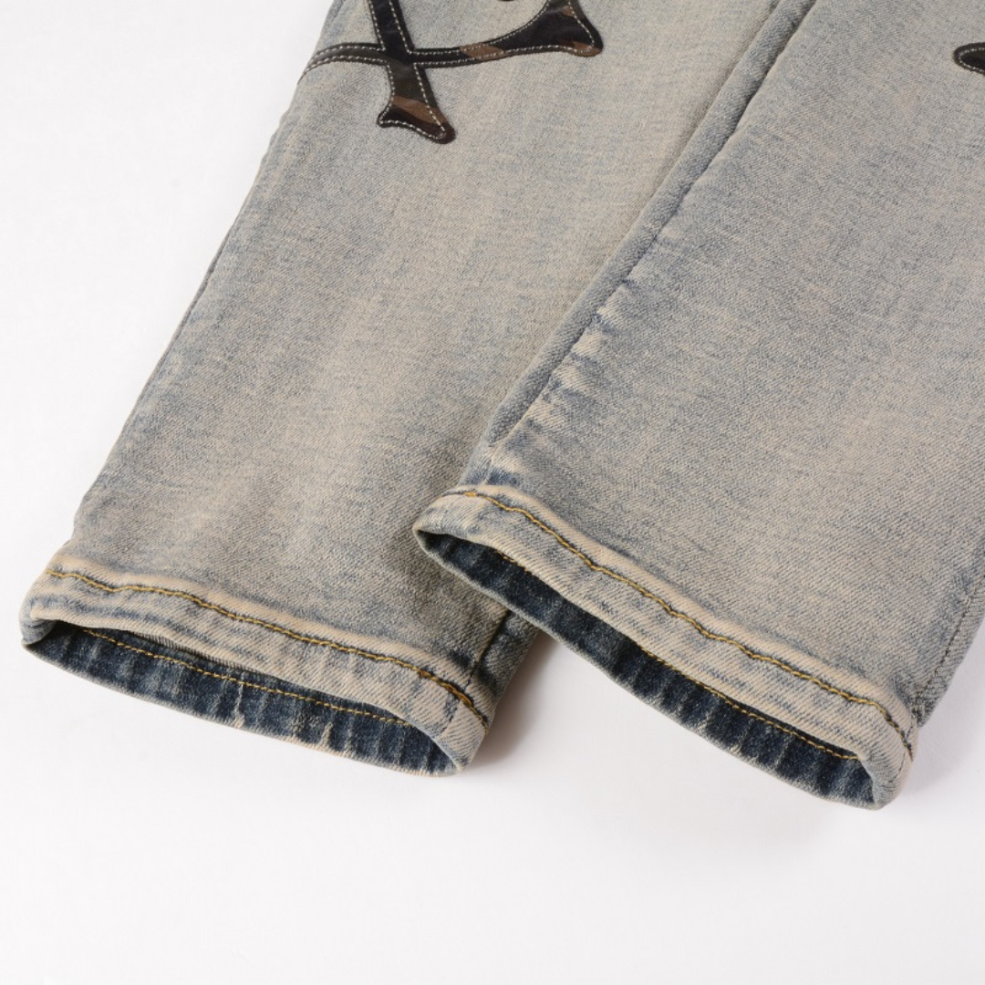 Black Bones Ripped Blue Jeans